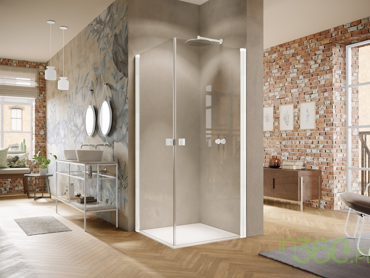 Nowoczesna łazienka w stylu industrialnym, wyposażona w białą kabinę prysznicową marki Hüppe, surowe wykończenia i minimalistyczny design, idealna do loftowych wnętrz.