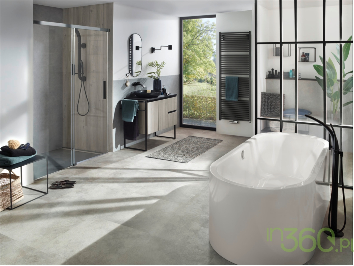 Elegancka łazienka wyposażona w białą wannę Kaldewei Central Duo Oval, z nowoczesnymi wykończeniami i minimalistycznym designem, idealna do luksusowych aranżacji wnętrz.