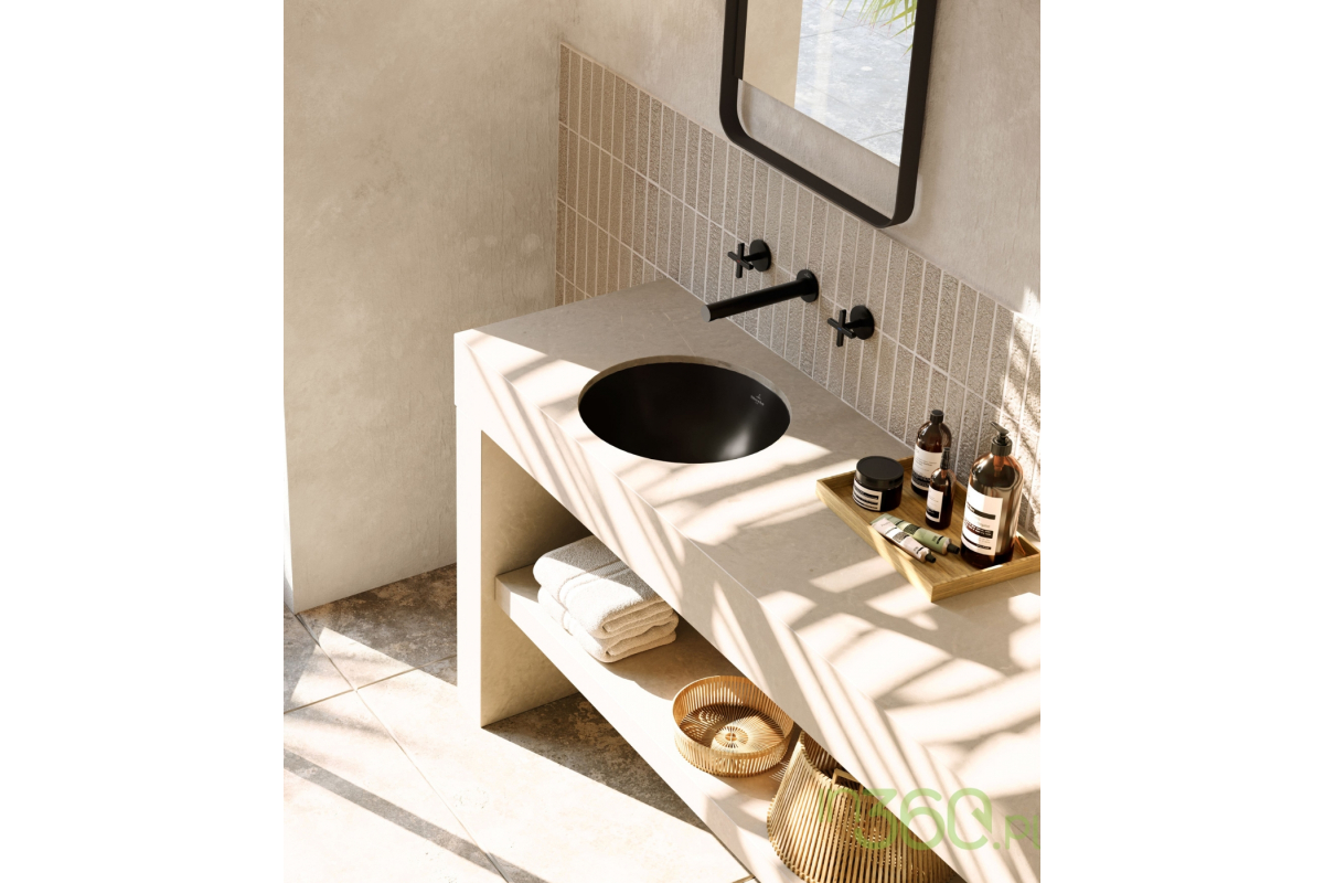 Elegancka łazienka wyposażona w okrągłą czarną umywalkę podblatową marki Villeroy & Boch, nowoczesne wykończenia i minimalistyczny design, idealna do luksusowych aranżacji wnętrz.