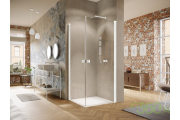 Nowoczesna łazienka w stylu industrialnym, wyposażona w białą kabinę prysznicową marki Hüppe, surowe wykończenia i minimalistyczny design, idealna do loftowych wnętrz.