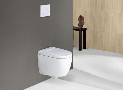 Toaleta myjąca z ukrytym stelażem – nowoczesność i higiena w minimalistycznym stylu Nowoczesna toaleta myjąca z ukrytym stelażem i eleganckim panelem spłukującym na tle minimalistycznej łazienki