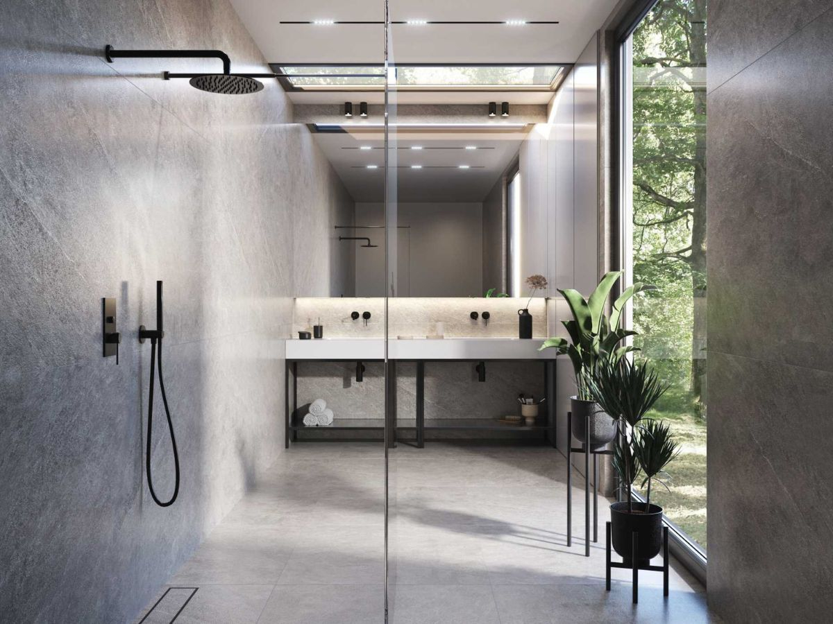 szara minimalistyczna lazienka z betonem i czarnym zestawem prysznicowym