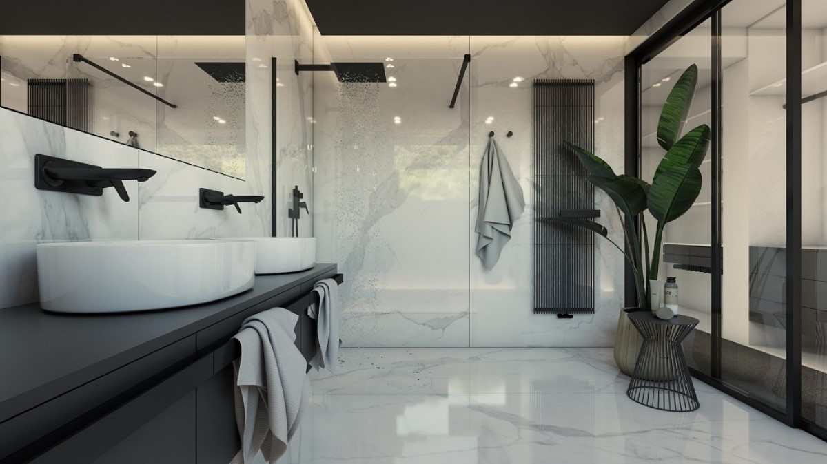 łazienka z czarną armaturą i płytkami imitujacymi marmur